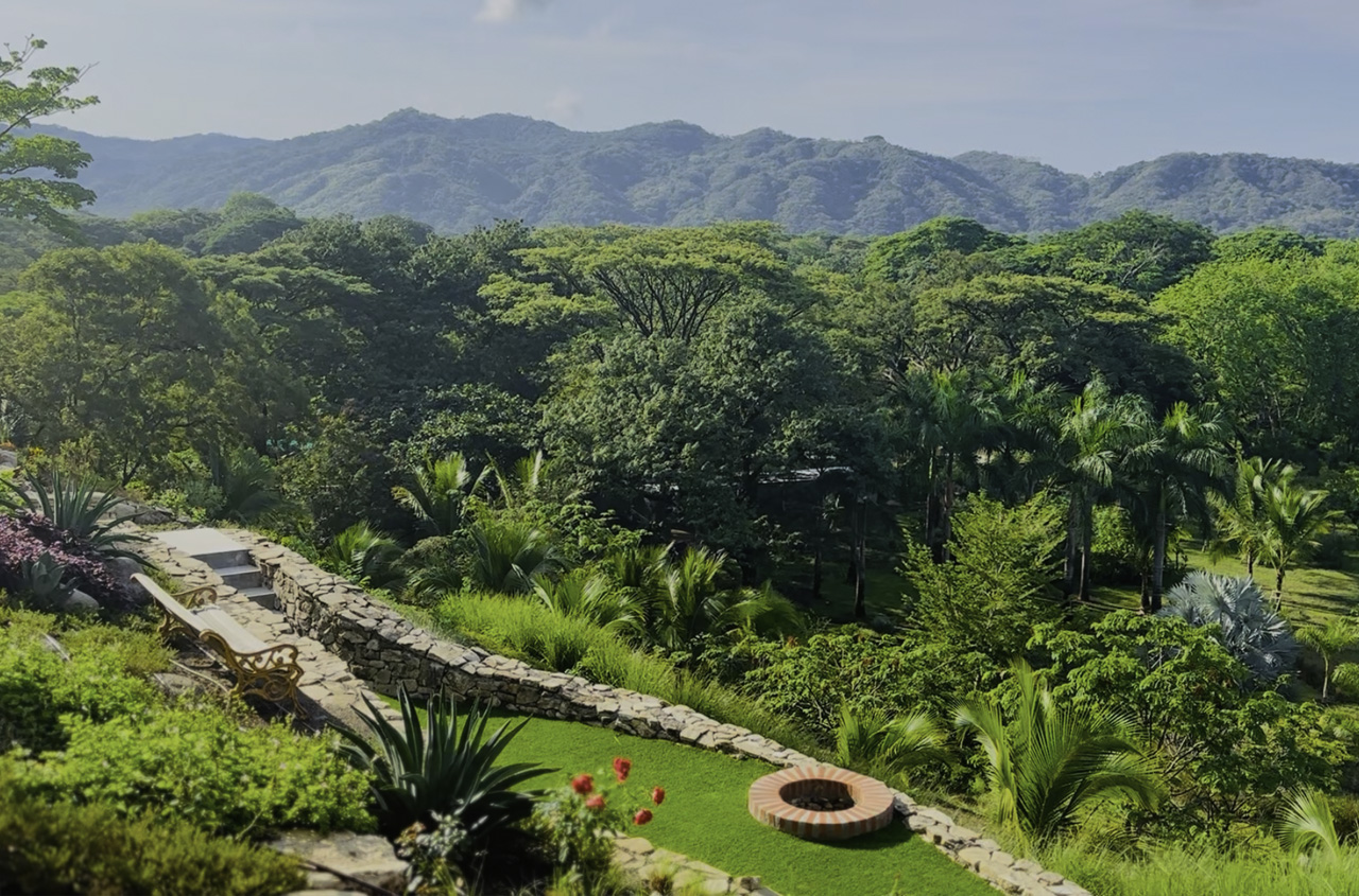 The green landscape of The Sanctuary Estate surrounded by Nosara's hills