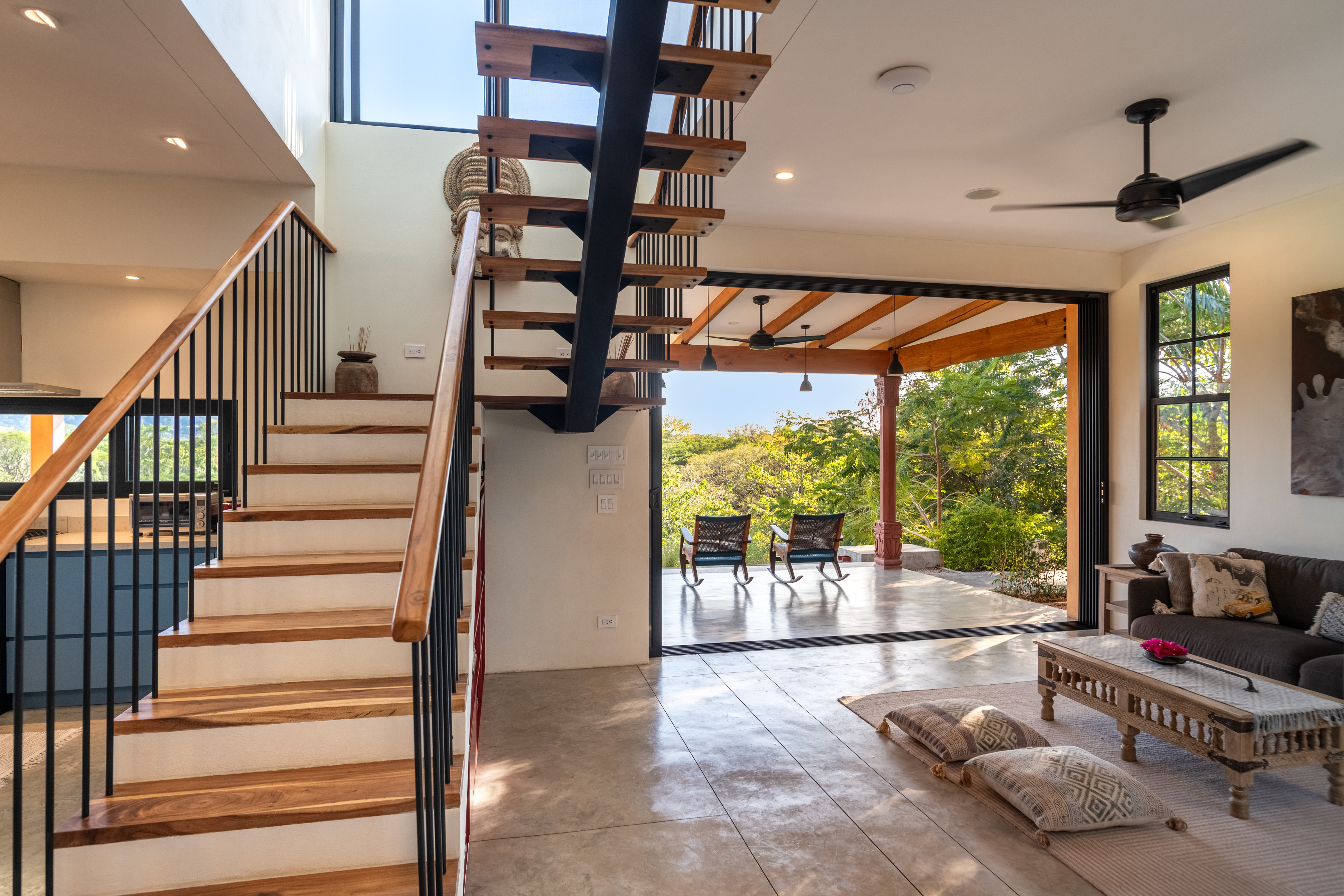 living area and staircase — The Sanctuary Estate, Nosara, Costa Rica