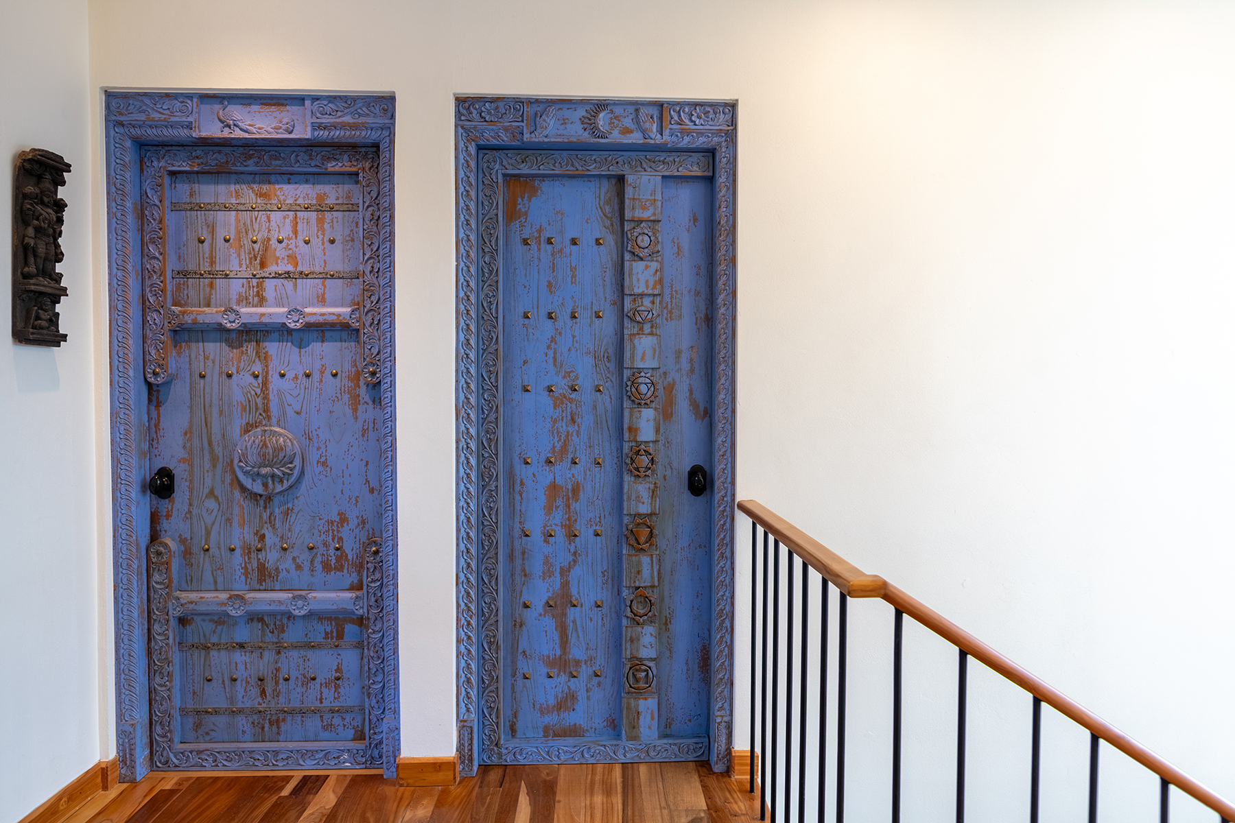 carved antique bedroom doors — The Sanctuary Estate, Nosara, Costa Rica