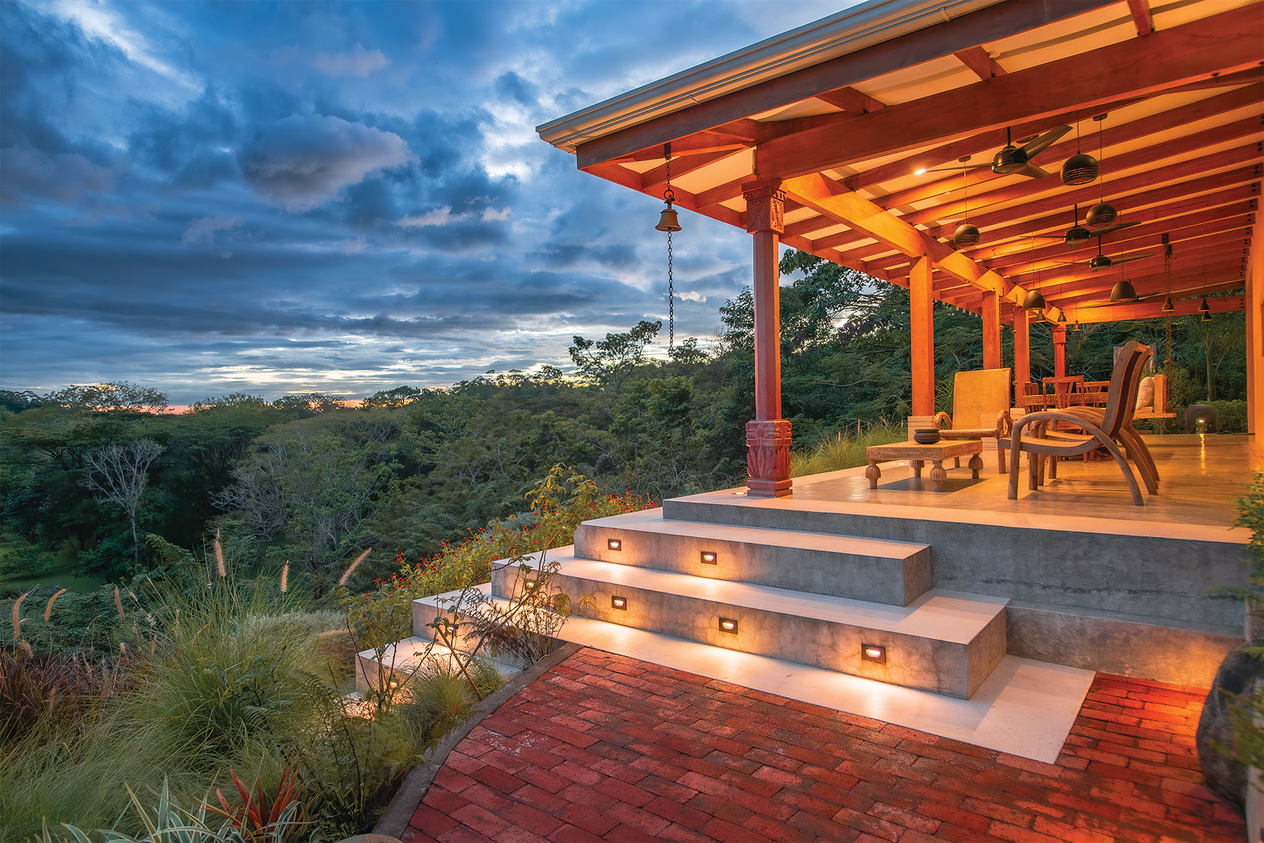 lit terrace steps at dusk — The Sanctuary Estate, Nosara, Costa Rica