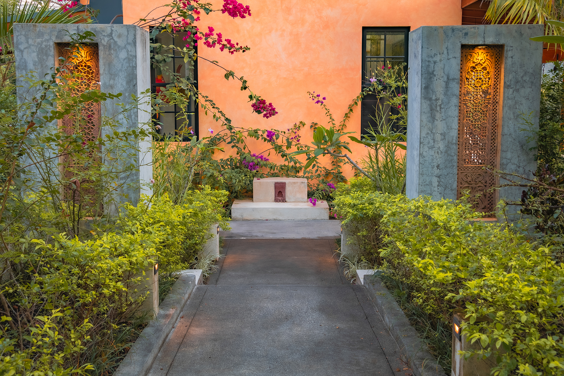 entry walkway bougainvillea dusk — The Sanctuary Estate, Nosara, Costa Rica